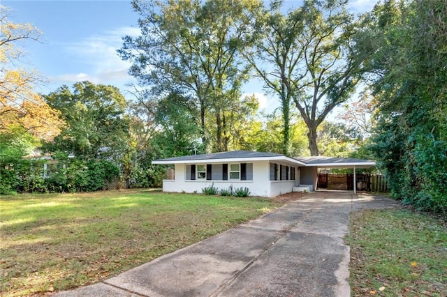 single story home featuring a front lawn and a carport