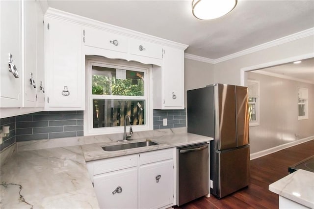 kitchen featuring decorative backsplash, appliances with stainless steel finishes, dark wood-type flooring, sink, and white cabinets