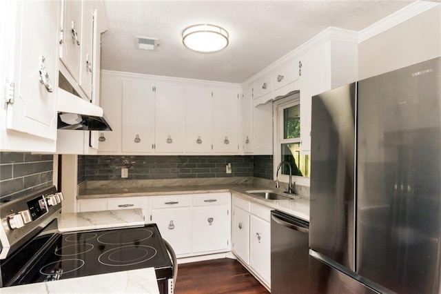 kitchen with white cabinetry, sink, stainless steel appliances, tasteful backsplash, and dark hardwood / wood-style floors