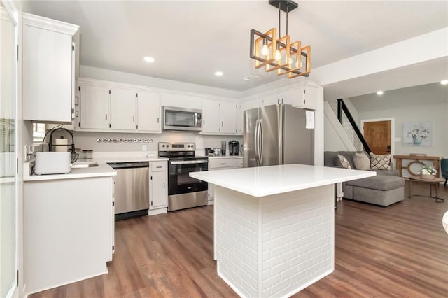3132 Wellborne Dr W, Mobile, AL 36695 - kitchen featuring stainless steel appliances, dark wood-type flooring, light countertops, recessed lighting, and a chandelier