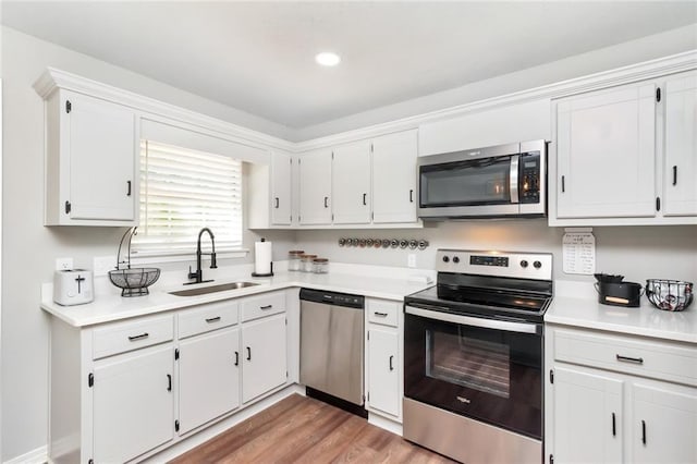 3132 Wellborne Dr W, Mobile, AL 36695 - kitchen featuring stainless steel appliances, light countertops, and white cabinetry