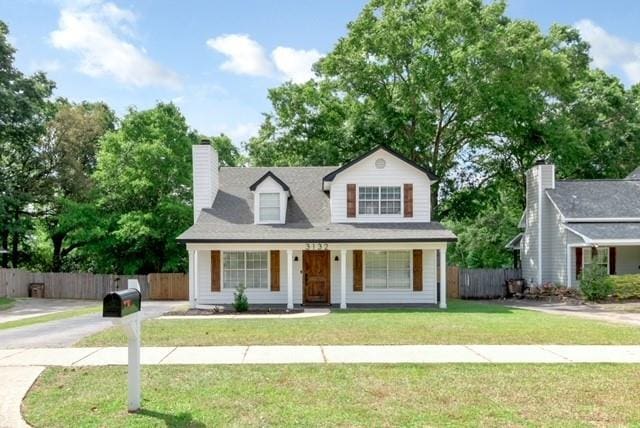 3132 Wellborne Dr W, Mobile, AL 36695 - view of front of house with a porch and a chimney