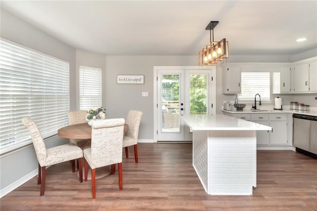 3132 Wellborne Dr W, Mobile, AL 36695 - kitchen featuring dishwasher, light countertops, dark wood-style floors, hanging light fixtures, and recessed lighting