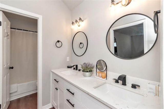3132 Wellborne Dr W, Mobile, AL 36695 - full bathroom with double vanity, wood finished floors, and shower / bathtub combination with curtain
