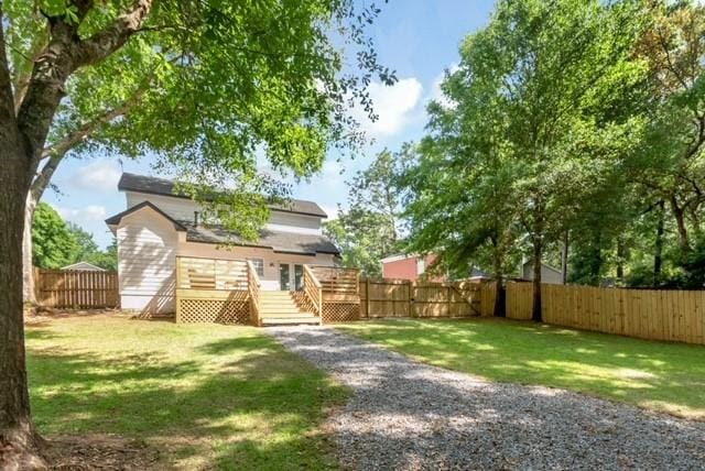 3132 Wellborne Dr W, Mobile, AL 36695 - rear view of house with a wooden deck and a fenced backyard