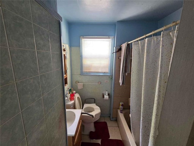 bathroom featuring tile walls, toilet, tile patterned flooring, shower / bath combo with shower curtain, and vanity