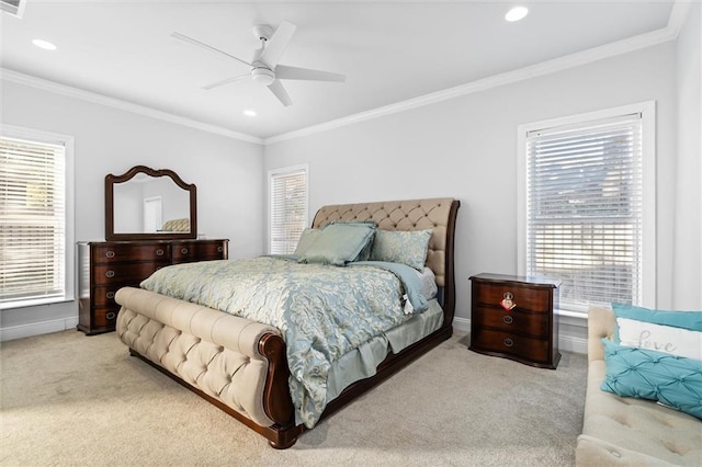 carpeted bedroom with ceiling fan and ornamental molding