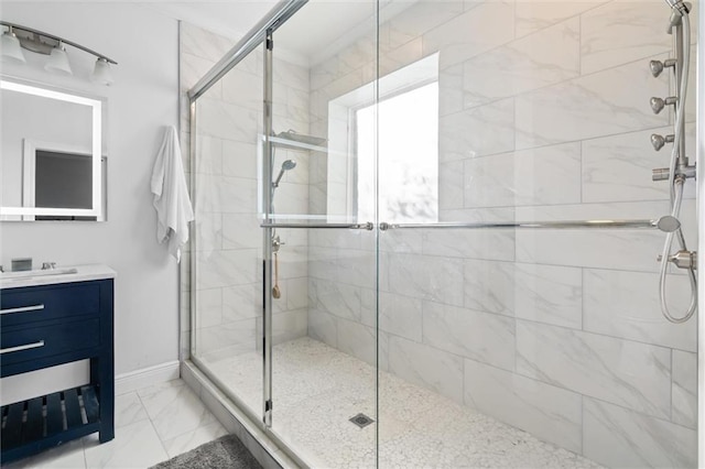 bathroom featuring vanity and an enclosed shower