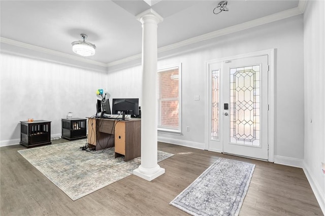 home office featuring decorative columns, ornamental molding, and hardwood / wood-style flooring