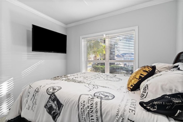 bedroom with ornamental molding