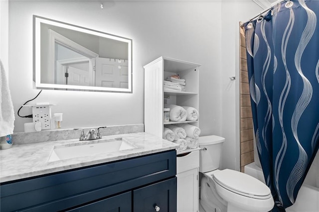 full bathroom with vanity, toilet, and shower / bath combo with shower curtain