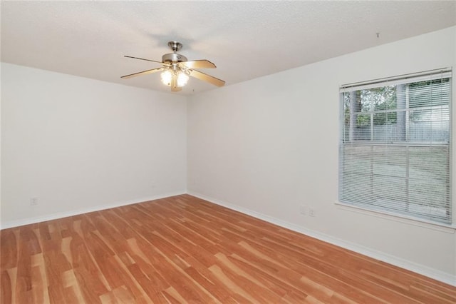 unfurnished room featuring hardwood / wood-style floors and ceiling fan