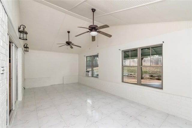 empty room featuring lofted ceiling, cooling unit, and ceiling fan