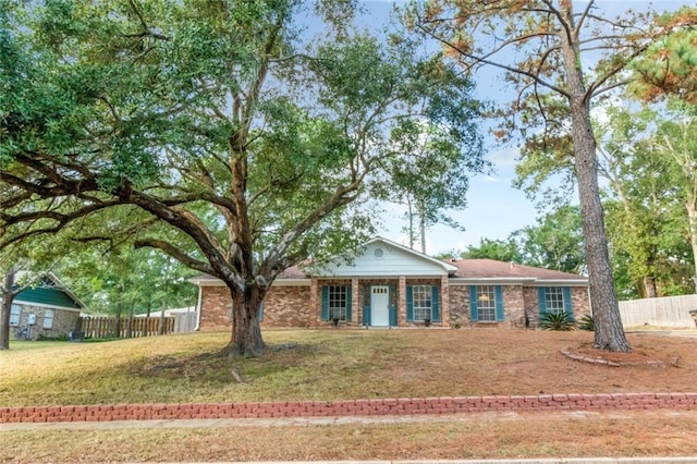 ranch-style home with a front lawn