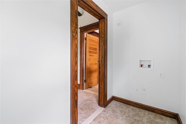 laundry room featuring washer hookup and light tile patterned flooring