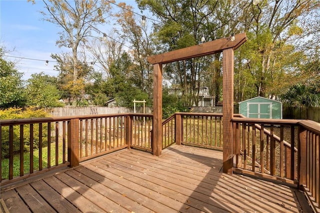 wooden terrace featuring a storage unit