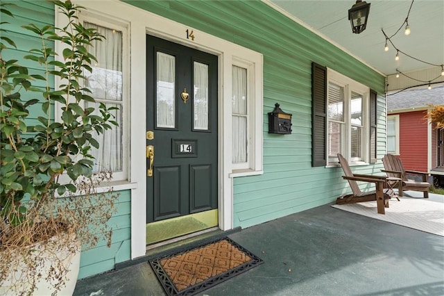 doorway to property featuring a porch