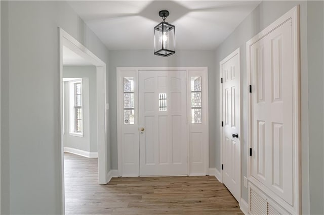 entrance foyer with hardwood / wood-style flooring and plenty of natural light