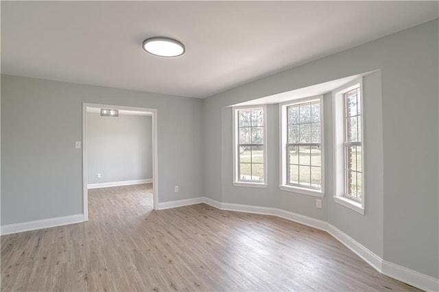 unfurnished room featuring light hardwood / wood-style floors