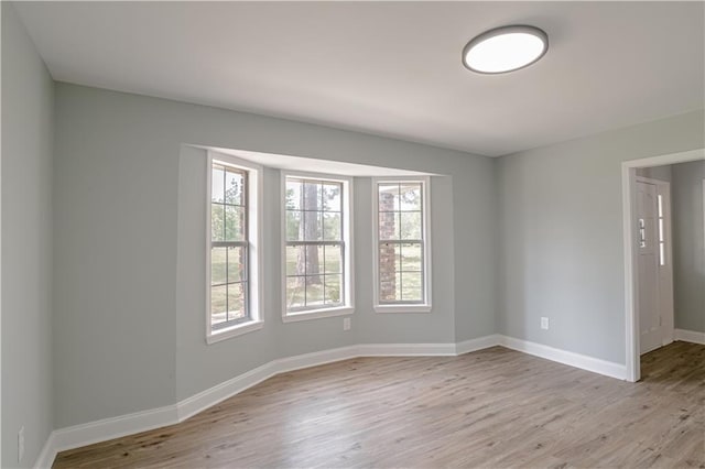 unfurnished room featuring light hardwood / wood-style flooring