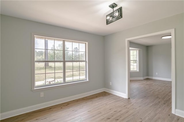 unfurnished room featuring light hardwood / wood-style floors