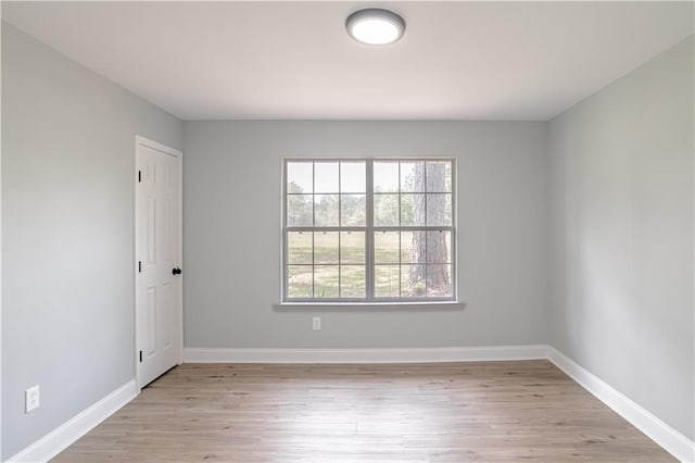 spare room featuring light hardwood / wood-style flooring