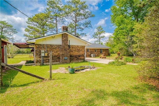 back of property with a patio and a lawn