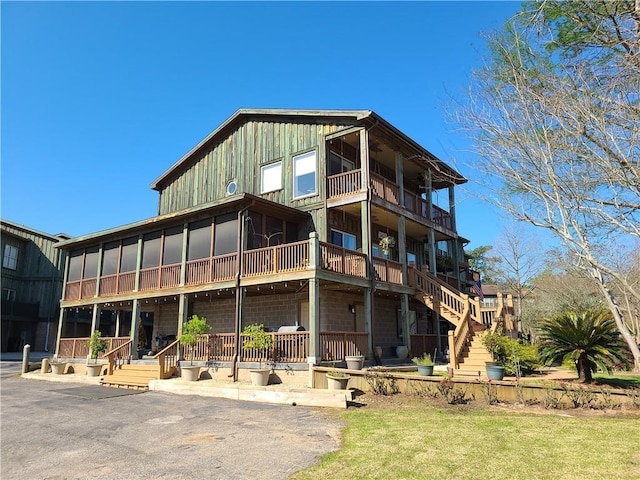 back of property featuring a balcony