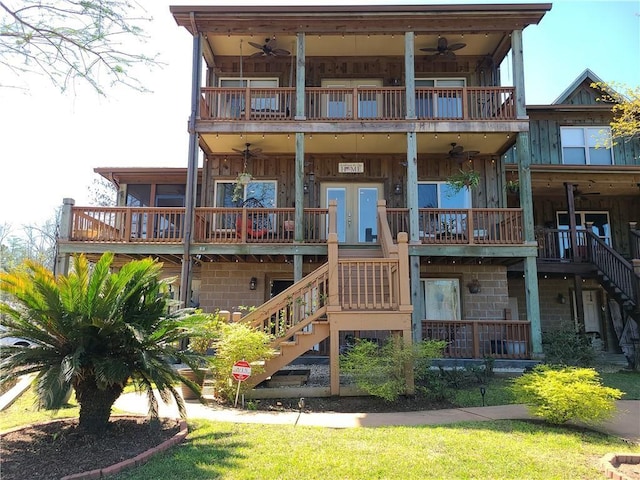 back of house featuring a balcony and french doors