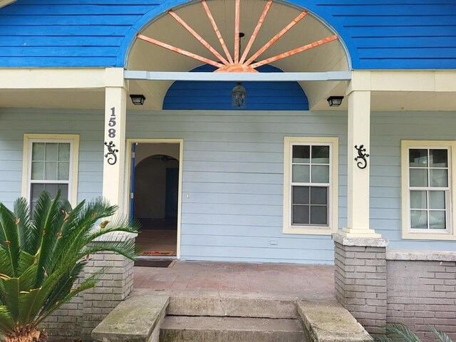 158 Randolph St, Mobile, AL 36607 - view of exterior entry with a porch