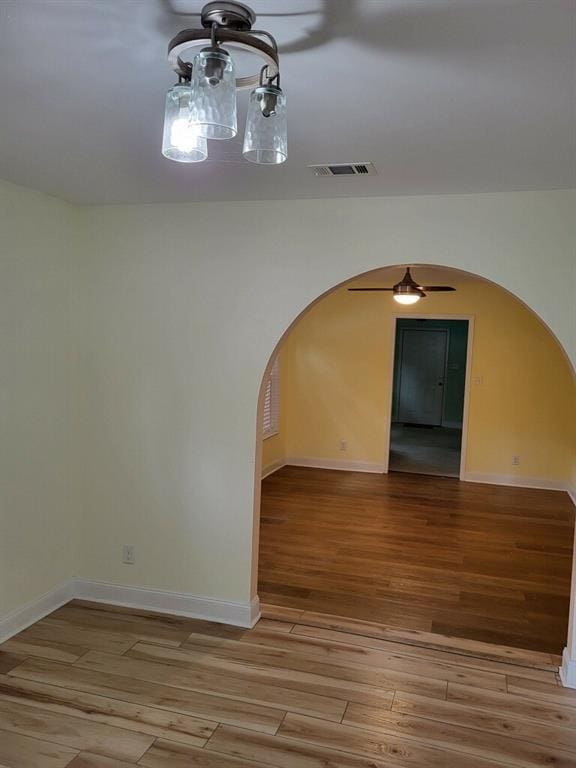 158 Randolph St, Mobile, AL 36607 - bonus room featuring arched walkways, light wood-style flooring, a ceiling fan, baseboards, and visible vents
