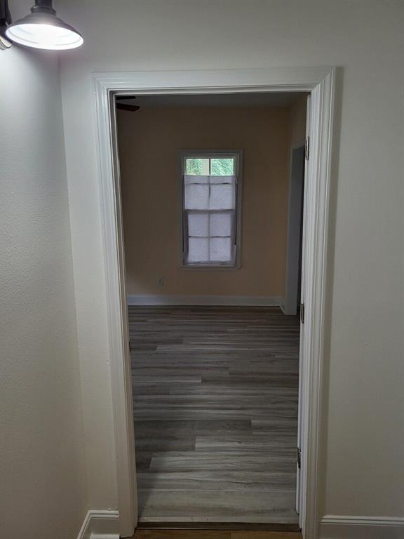 158 Randolph St, Mobile, AL 36607 - hallway featuring baseboards and wood finished floors