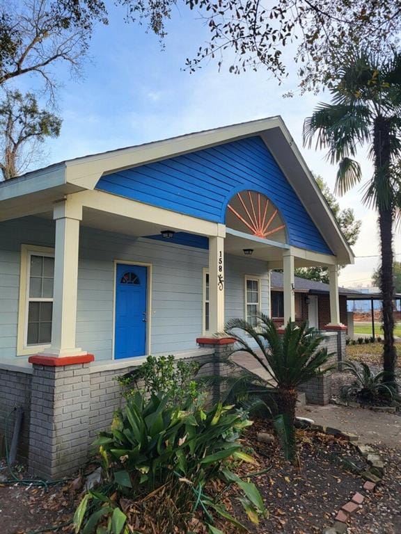 158 Randolph St, Mobile, AL 36607 - bungalow-style home featuring a porch and brick siding