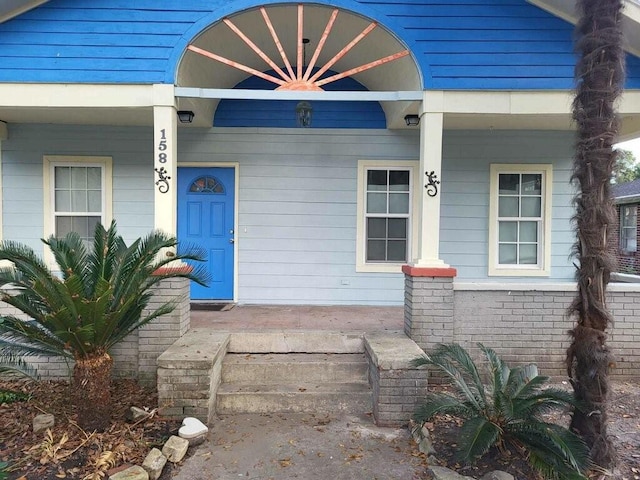 158 Randolph St, Mobile, AL 36607 - property entrance with a porch