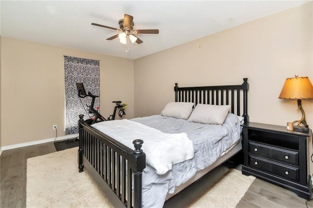 bedroom featuring wood-type flooring and ceiling fan