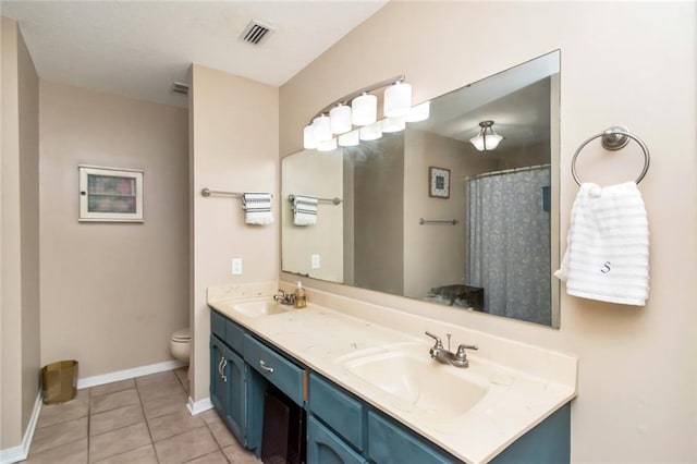 bathroom featuring vanity, curtained shower, tile patterned floors, and toilet