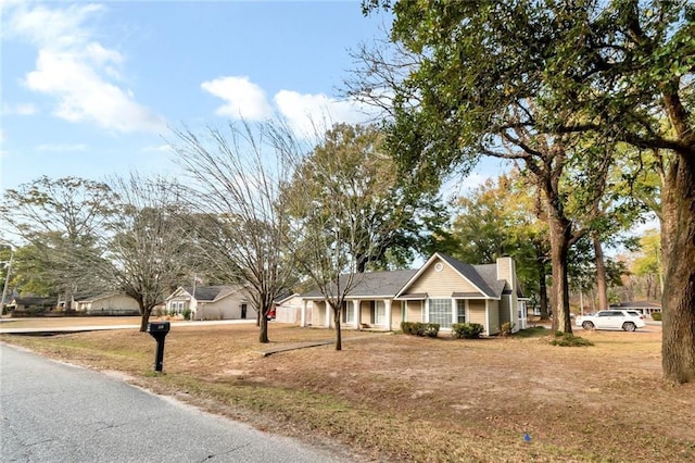 ranch-style home with a front lawn