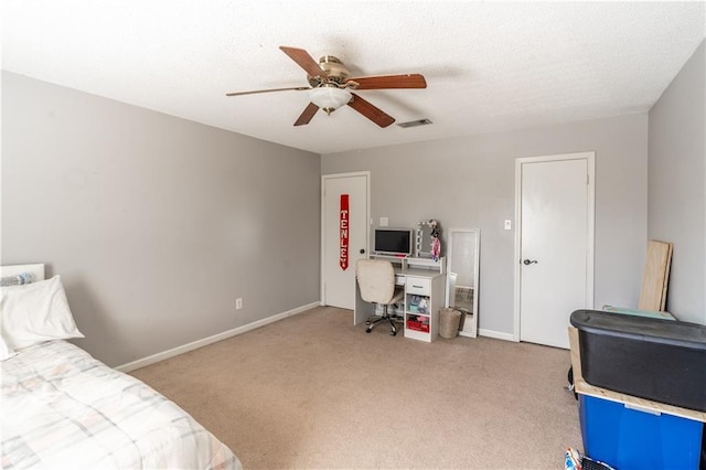 bedroom featuring light carpet, baseboards, visible vents, a ceiling fan, and a textured ceiling