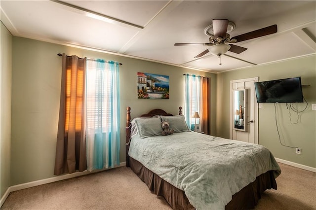 bedroom with light carpet, ceiling fan, and baseboards