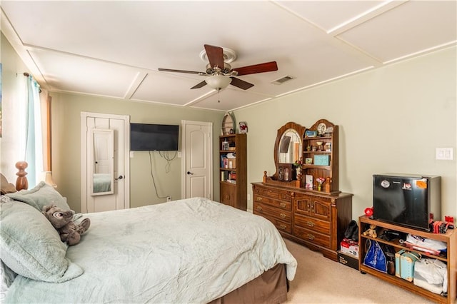 carpeted bedroom featuring visible vents and ceiling fan