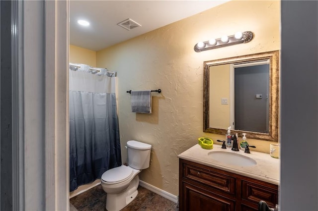 bathroom with baseboards, visible vents, a textured wall, toilet, and vanity