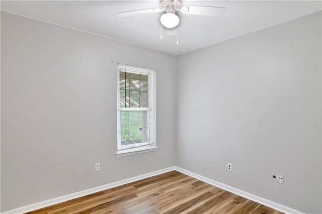 unfurnished room featuring hardwood / wood-style floors and ceiling fan