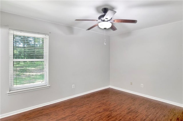 unfurnished room with dark hardwood / wood-style floors, ceiling fan, and plenty of natural light