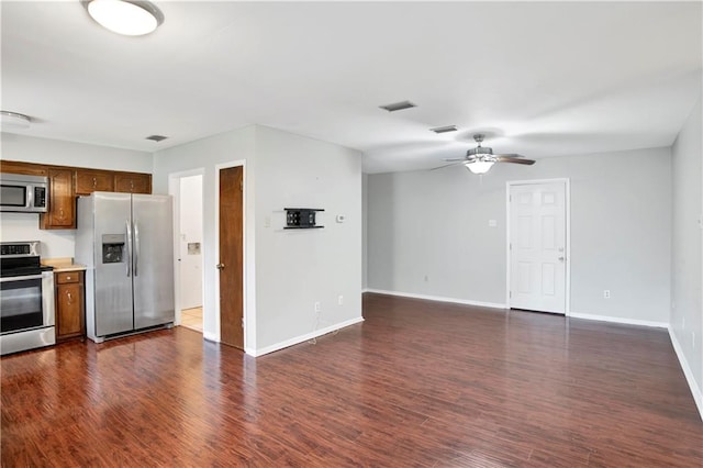 kitchen with ceiling fan, appliances with stainless steel finishes, and dark hardwood / wood-style flooring