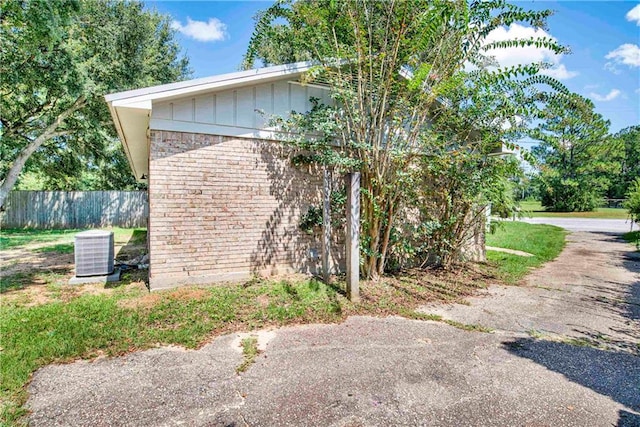 view of property exterior with central AC