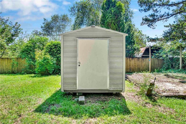 view of outdoor structure with a lawn