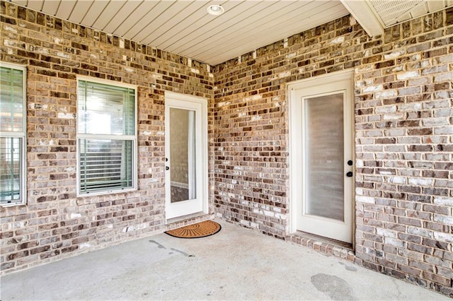 doorway to property with a patio area