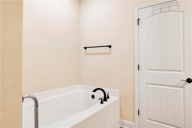 bathroom featuring a tub to relax in