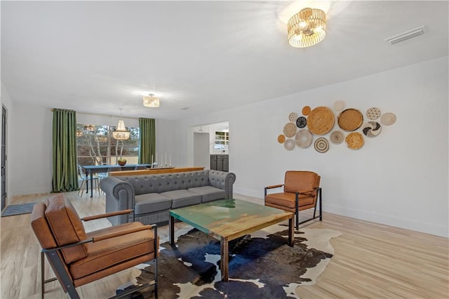 living room with light hardwood / wood-style floors