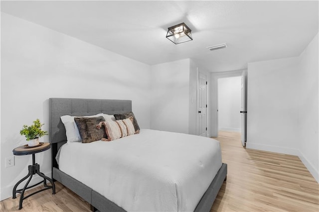 bedroom with light hardwood / wood-style floors